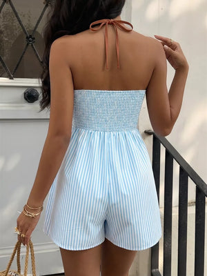 Blue and white striped halter neck romper with smocked bodice and tie back.