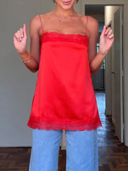 Red satin cami top with lace trim detail and spaghetti straps.