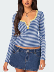 Blue and white striped henley shirt with contrast yellow collar and button detail