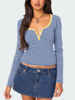 Blue and white striped henley shirt with contrast yellow collar and button detail