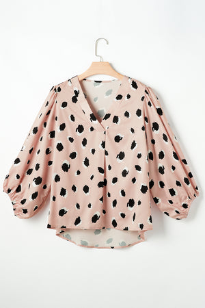 Pink silk blouse with blouson sleeves and a spot print.