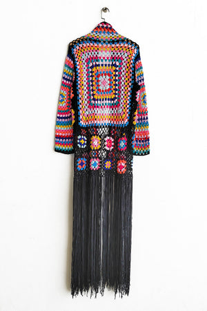 Granny square crochet duster with fringe in multicolor and black, open front, long sleeve, boho style.