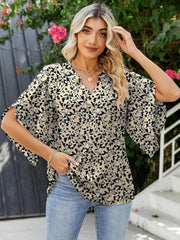 Floral print blouse with flutter sleeves and V-neck in beige and black polyester.