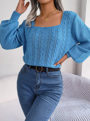 Azure cable knit sweater with square neckline and balloon sleeves.