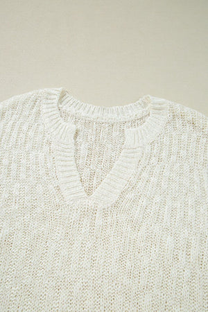 Beige textured knit V-neck shell top with ribbed neckline and cuffs