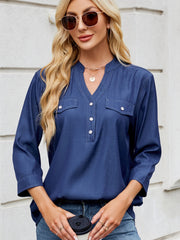 Dark navy denim henley blouse with chest pockets and contrast stitching.