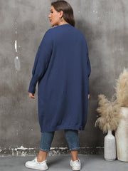 Oversized dark blue knit duster cardigan with long sleeves and ribbed cuffs.