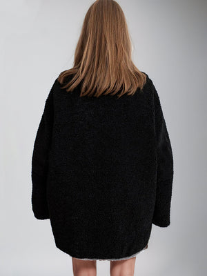 Black teddy fleece zip-up jacket with contrast piping detail on hem