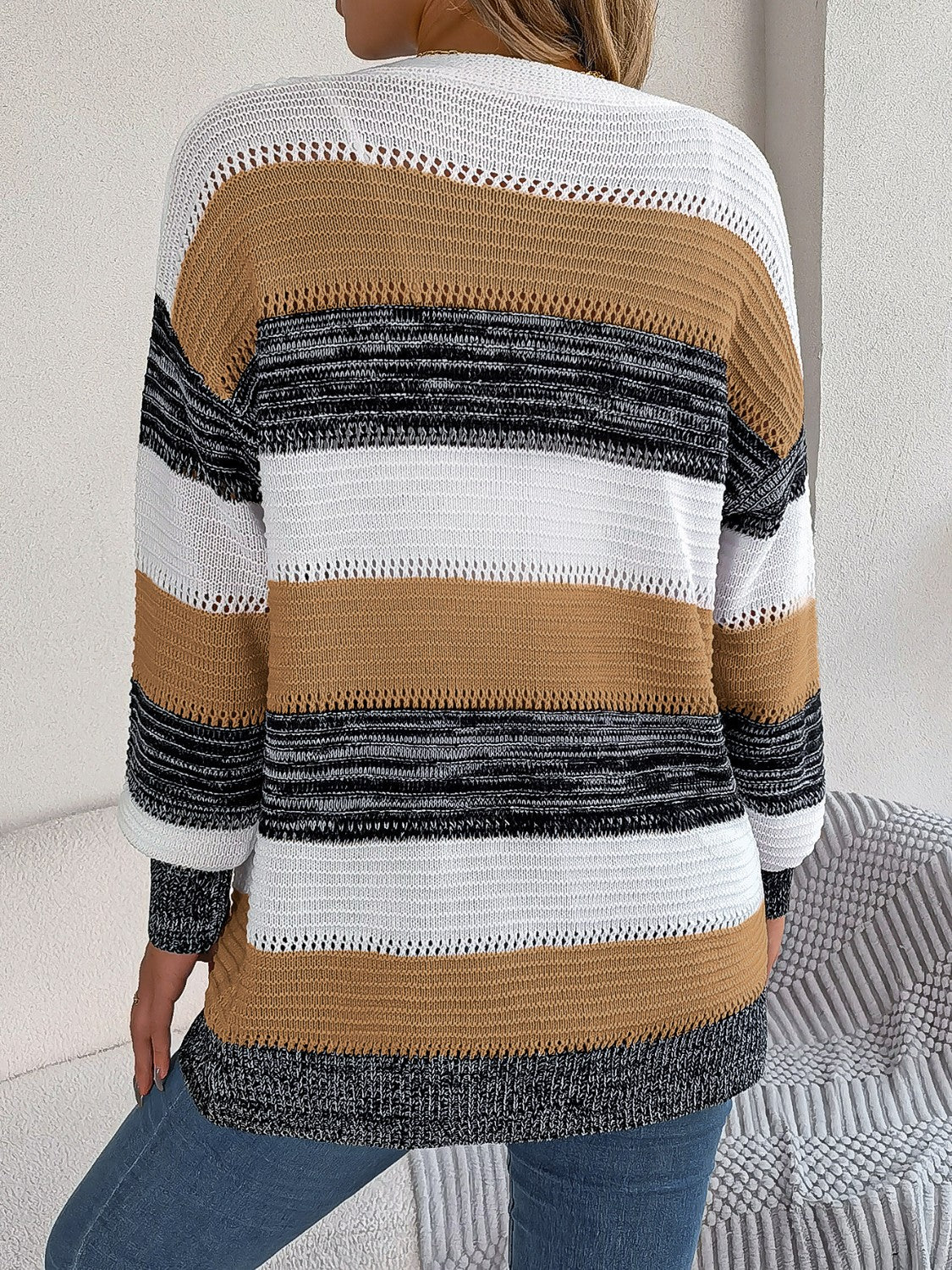 Horizontal stripe open-front knit cardigan in camel, white, and black acrylic with open knit details.