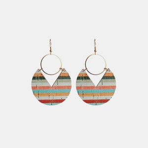 Geometric striped wood drop earrings with gold hoops and a V-cut detail.