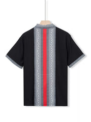 Black short sleeve men's shirt with bold geometric print and red stripe detail.