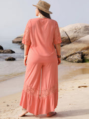 Coral viscose jumpsuit with lace sleeves and hem detail, wide leg pants