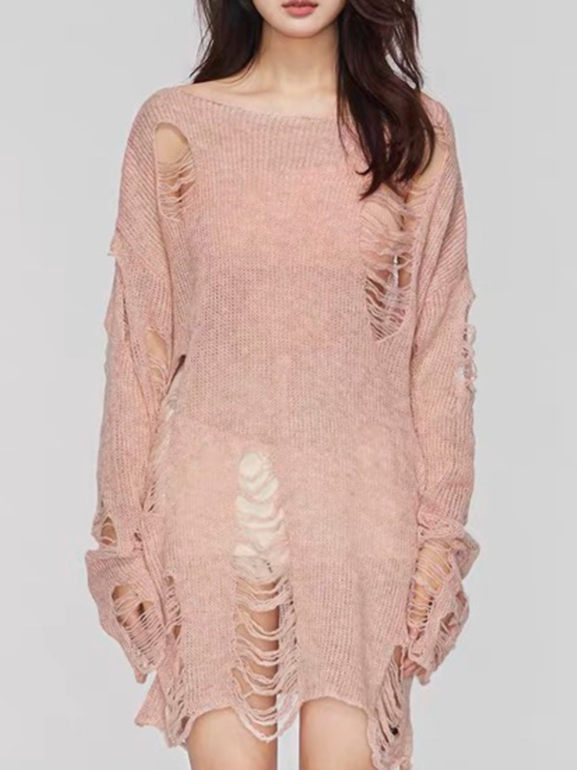 Ripped knit oversized beach pullover sweater in watermelon pink with boat neck and distressed details.