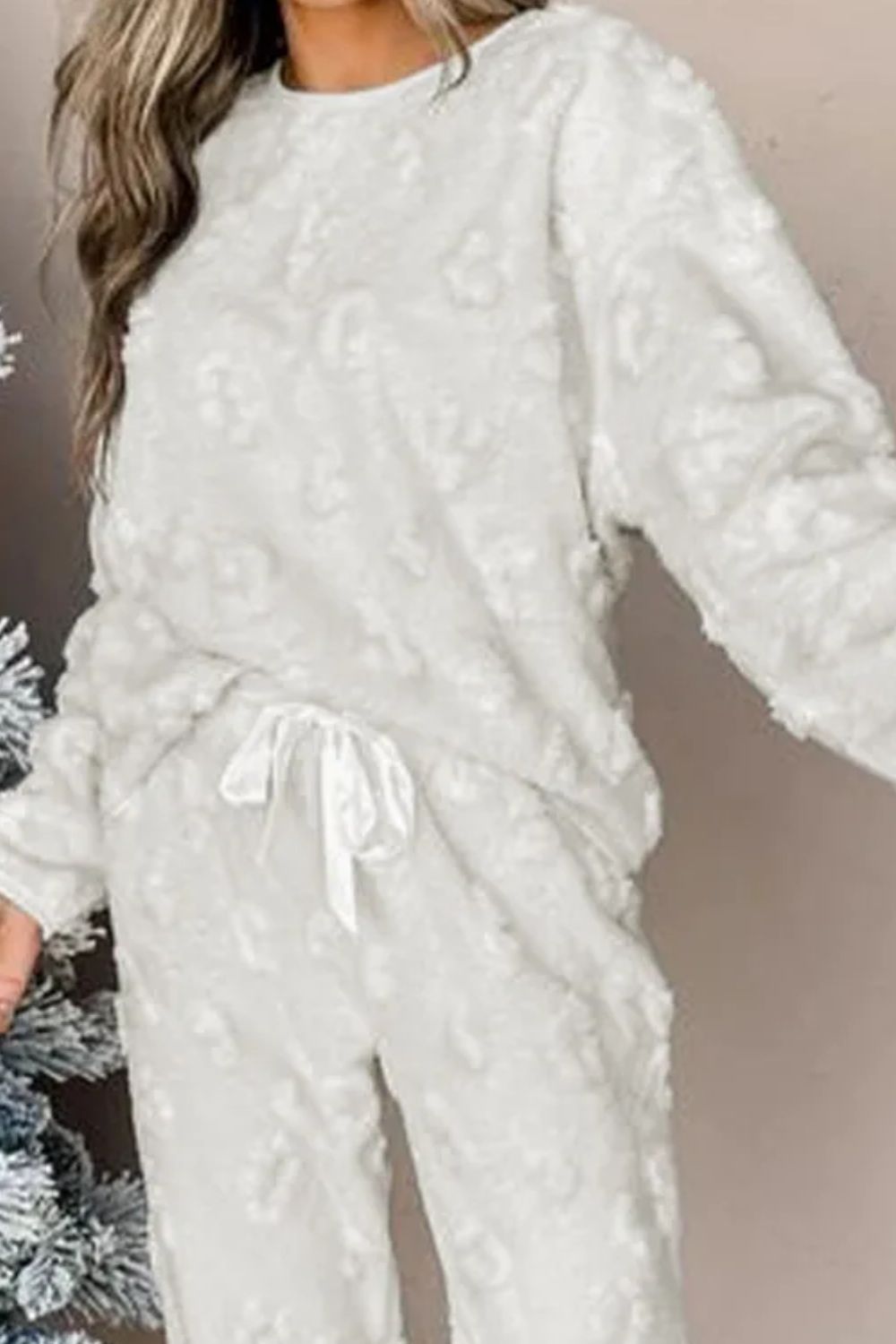 White textured leopard loungewear set with crewneck top and drawstring pants.