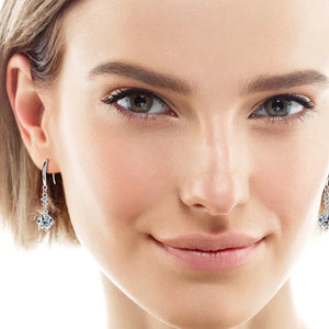 Silver celestial drop pendant earrings with clear cubic zirconia stones.
