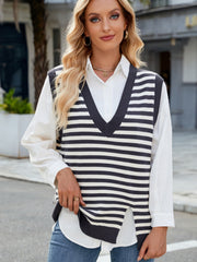 Striped knit v-neck vest in dark gray and cream with side slits, worn over a white shirt.