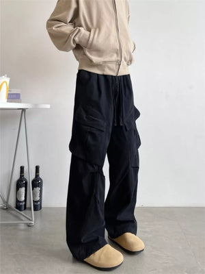 Black relaxed fit cargo pants with drawstring and multi pockets.