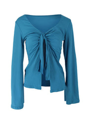Blue tie-front long sleeve blouse with a deep V-neckline and ruched detailing.