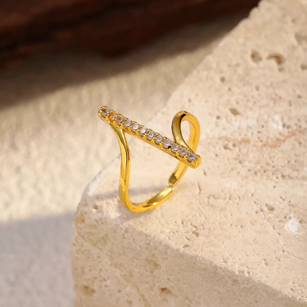 Gold contemporary ring with rhinestone bar detail
