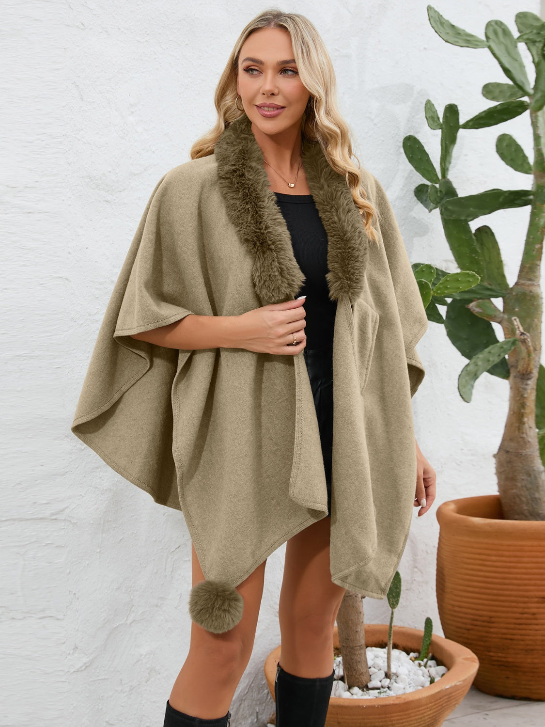 Camel faux fur collar wrap poncho with pom-pom detail.