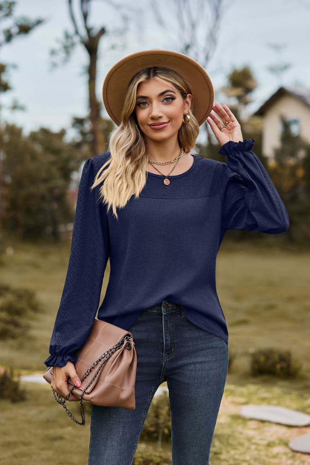 Dark Navy waffle knit blouse with perforated yoke and ruffled cuffs