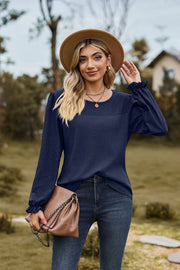 Dark Navy waffle knit blouse with perforated yoke and ruffled cuffs