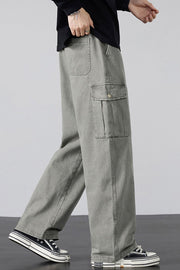 Gray relaxed fit cargo sweatpants with drawstring and buttoned flap pocket.