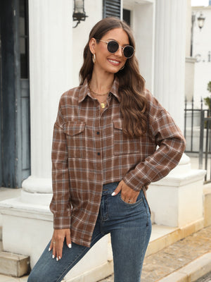 Brown plaid button-up shirt with two chest pockets.