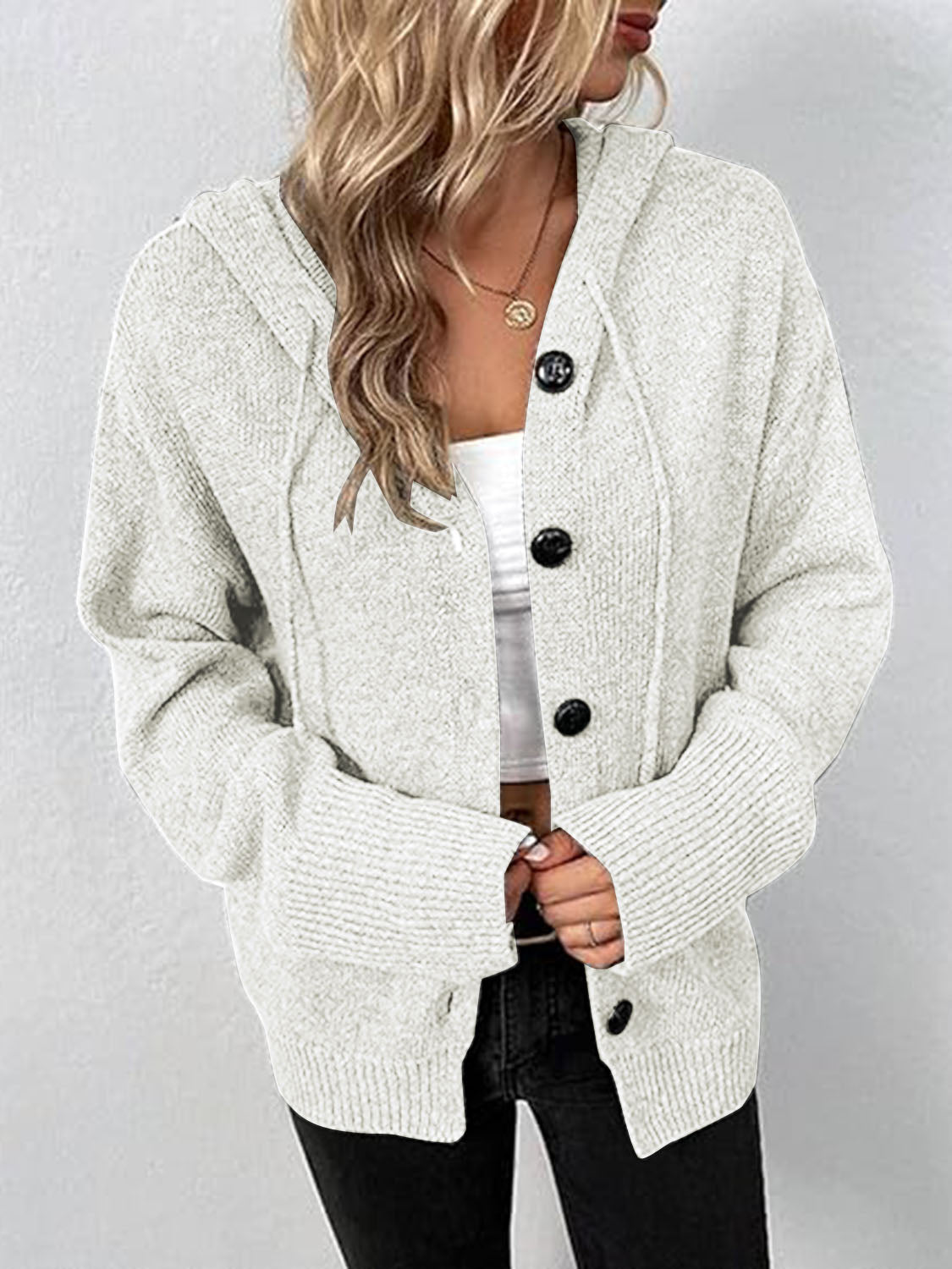 Gray ribbed knit hooded cardigan with button front and drawstring details.