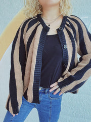 Bold stripe knit cardigan in tan and black with button front and crew neck.