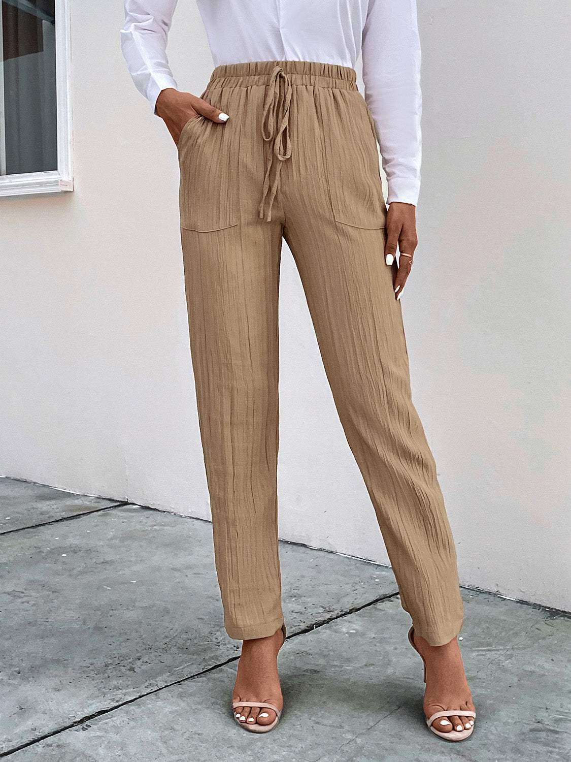 Tan textured drawstring waist tapered trousers with pockets