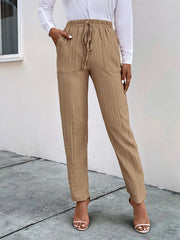 Tan textured drawstring waist tapered trousers with pockets