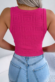 Hot pink knit tank top with geometric pattern and cropped length