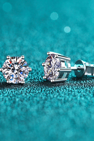 Silver six-prong solitaire stud earrings with clear cubic zirconia stones.