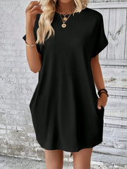 Black relaxed tee dress with cuffed sleeves and pockets