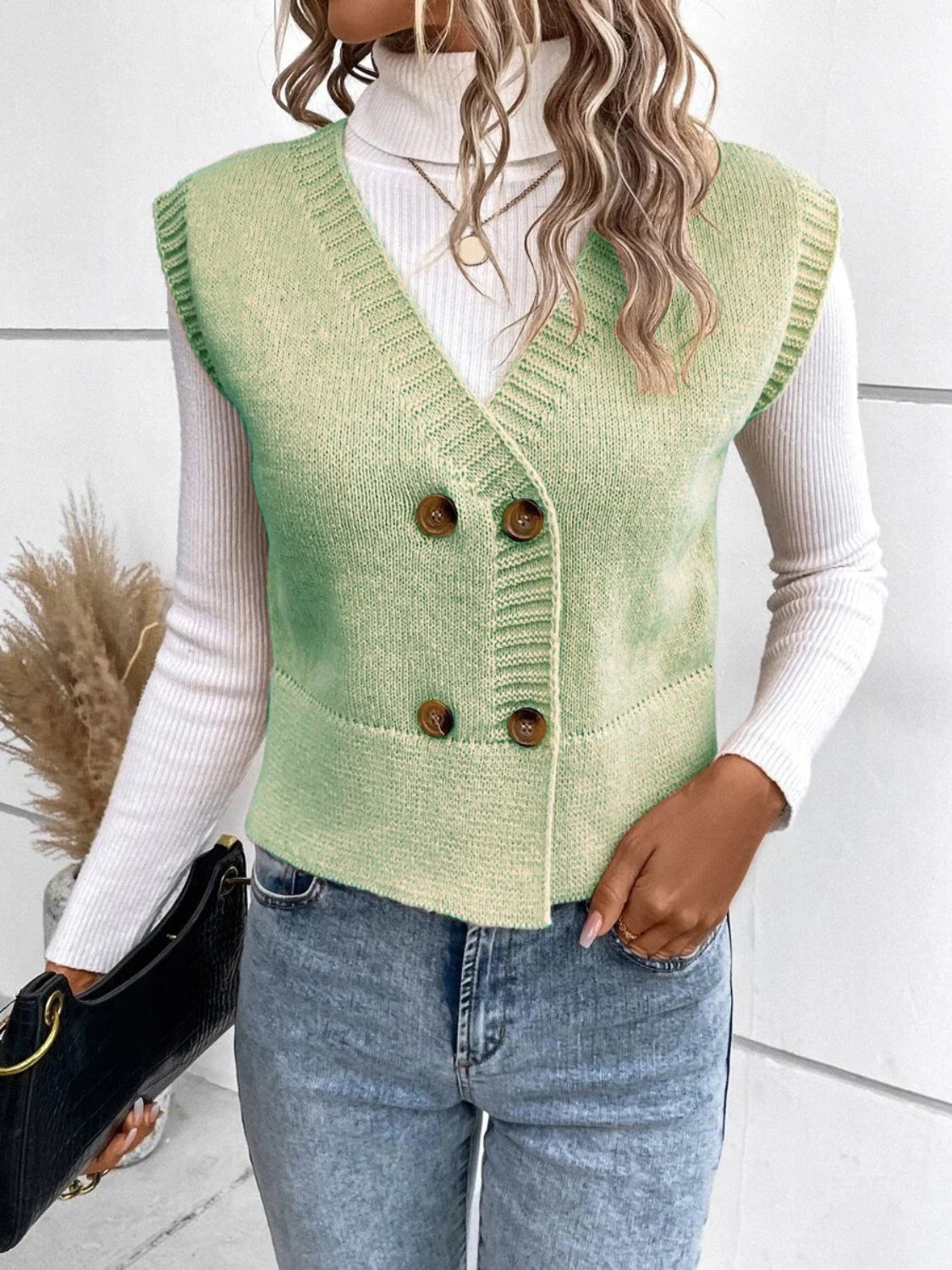 Light green double-breasted knit vest with ribbed trim and buttons