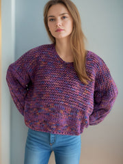 Textured knit sweater in purple with balloon sleeves and a V-neck.