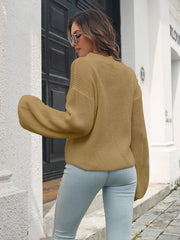 Camel batwing sleeve knit pullover sweater with ribbed texture.