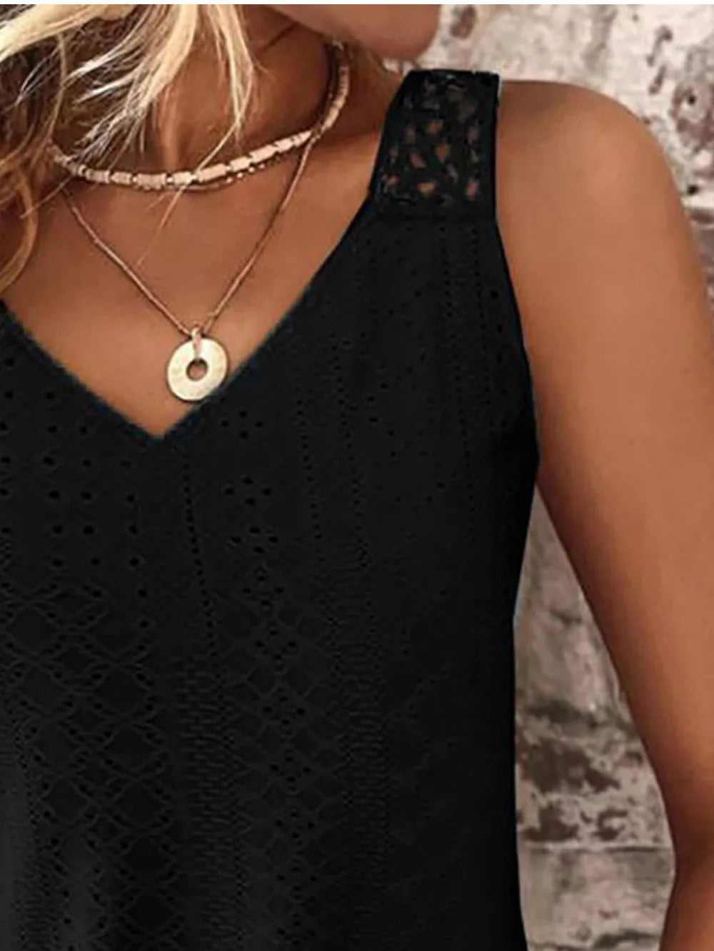 Black eyelet lace V-neck tank top with lace shoulder detail.