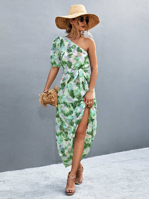 Light green tropical print one-shoulder maxi dress with balloon sleeves and a high slit.