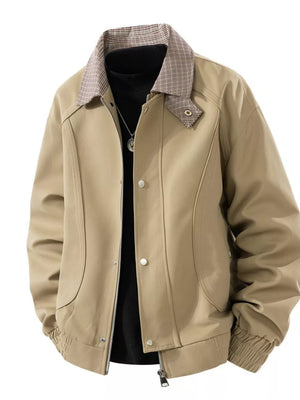 Khaki zip-up jacket with plaid collar and button details.