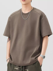 Oversized brown cotton blend t-shirt with crew neck and short sleeves.
