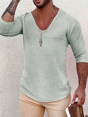 Textured slouchy knit top in sage with a deep V-neck and 3/4 sleeves
