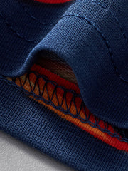 Boys' navy cotton underwear set detail with red and orange striped trim.