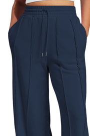 Dark navy wide leg lounge trousers with drawstring waist and seamed details.