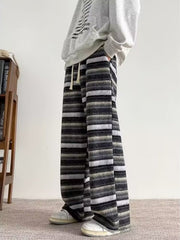 Men's wide-leg pants with a horizontal striped pattern and drawstring waist.