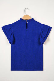 Blue textured short sleeve shirt with ruffle trim and mock neck