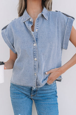 Light blue denim shirt jacket with rolled sleeves and button front.