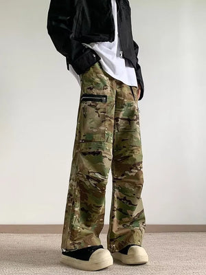 Oversized camouflage cargo pants with zipper pockets and a relaxed fit.