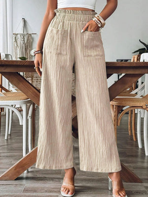 Textured wide-leg palazzo trousers in khaki with elastic waist and pockets.
